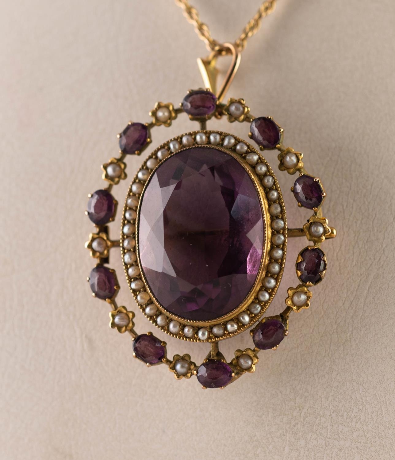 LATE VICTORIAN GOLD COLOUR METAL (unmarked) BROOCH set with a large central amethyst framed with - Image 3 of 3