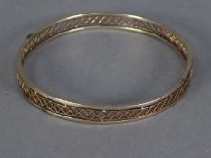 TWO COLOUR GOLD BANGLE, rose gold pierced trellis pattern with white gold solid borders,