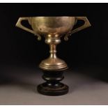 GEORGE V SILVER TWO HANDLED TROPHY CUP, of typical form with angular scroll handles, 7 ¼? (18.4cm)