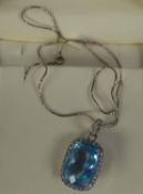 18ct WHITE GOLD, TOPAZ AND DIAMOND PENDANT on an 18ct WHITE GOLD FINE CHAIN NECKLACE, the pendant