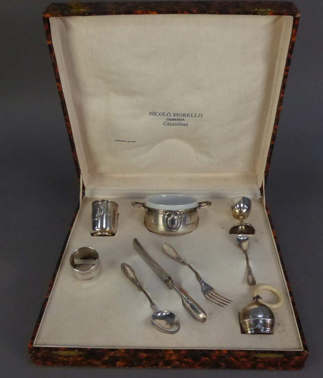 CASED NINE PIECE EMBOSSED FOREIGN SILVER COLOURED METAL CHRISTENING SET, RETAILED BY NICOLO - Image 2 of 3
