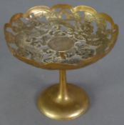 CHINESE ENGRAVED AND PIERCED SILVER COLOURED METAL PEDESTAL DISH, decorated with a four toed dragon,