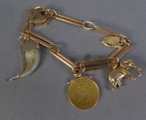 A GOLD COLOURED METAL CHAIN BRACELET, with long and short links (tests 18ct) and 9ct GOLD PADLOCK