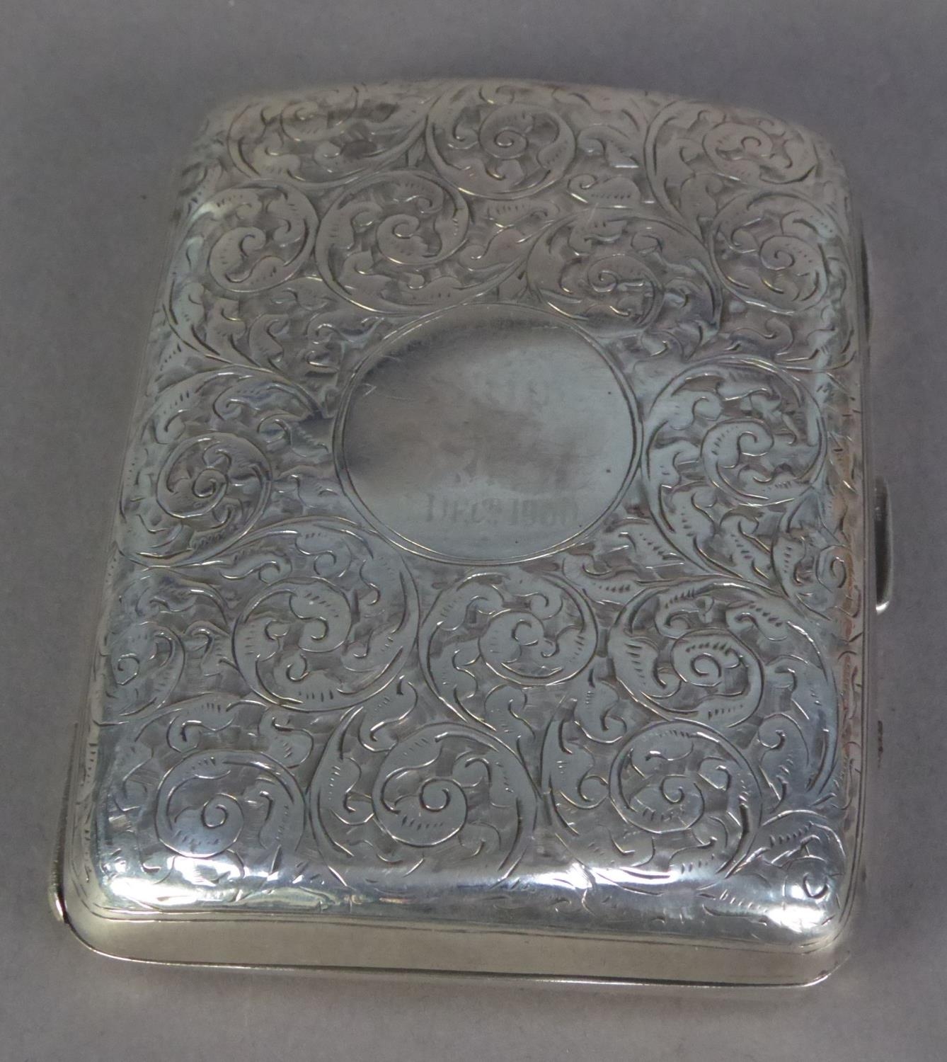 VICTORIAN ENGRAVED SILVER POCKET CIGARETTE CASE, of curved oblong form with foliate scroll work
