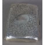 VICTORIAN ENGRAVED SILVER POCKET CIGARETTE CASE, of curved oblong form with foliate scroll work