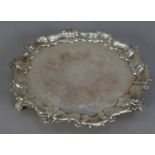 VICTORIAN CHASED SILVER SMALL SALVER, with foliate scroll chased centre, shell capped moulded border