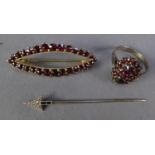 SILVER GILT LOZENGE SHAPED OPENWORK BROOCH, set with approx 28 small garnets, 2 1/2" wide (4cm); A
