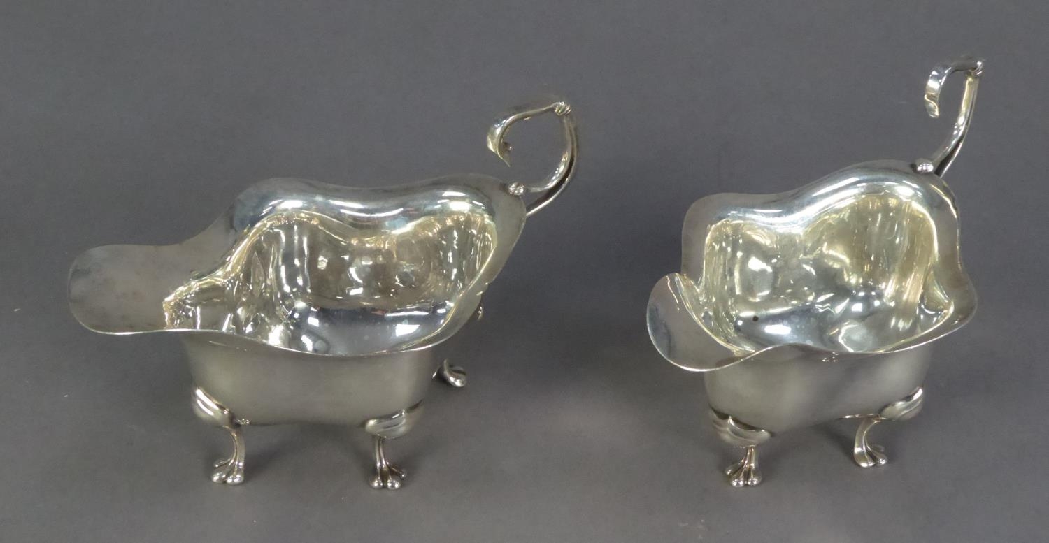 GEORGE V PAIR OF EIGHTEENTH CENTURY STYLE SILVER SAUCE BOATS BY WALKER & HALL, each of lozenge