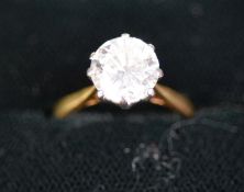 18ct GOLD AND PLATINUM RING set with a round brilliant cut diamond, approximately 2.80ct, 4.5 gms,