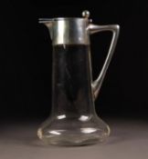 GERMAN SILVER COLOURED METAL (800 standard) MOUNTED PLAIN GLASS WATER JUG, with bulbous base and