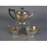 GEORGIAN STYLE ELECTROPLATE TEA SERVICE OF THREE PIECES, of oval form with two handle sucrier, the