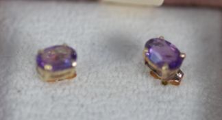 PAIR OF .375 STAMPED GOLD AMETHYST SET EARRINGS