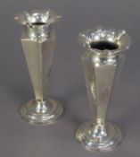 LATE VICTORIAN PAIR OF SILVER TRUMPET VASES, each of panelled form with moulded circular rim and