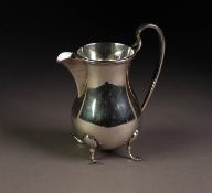 GEORGE V SILVER MILK JUG OF HEAVY GAUGE, of plain pyriform with high scroll handle and scroll