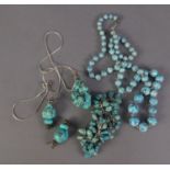 A SINGLE STRAND NECKLACE OF GRADUATED TURQUOISE BEADS, with silver clasp, 24" long; SILVER SNAKE