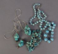 A SINGLE STRAND NECKLACE OF GRADUATED TURQUOISE BEADS, with silver clasp, 24" long; SILVER SNAKE