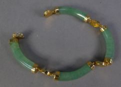 CHINESE GOLD PLATED BRACELET, with four pale green jade links, curbed cylindrical bar links with