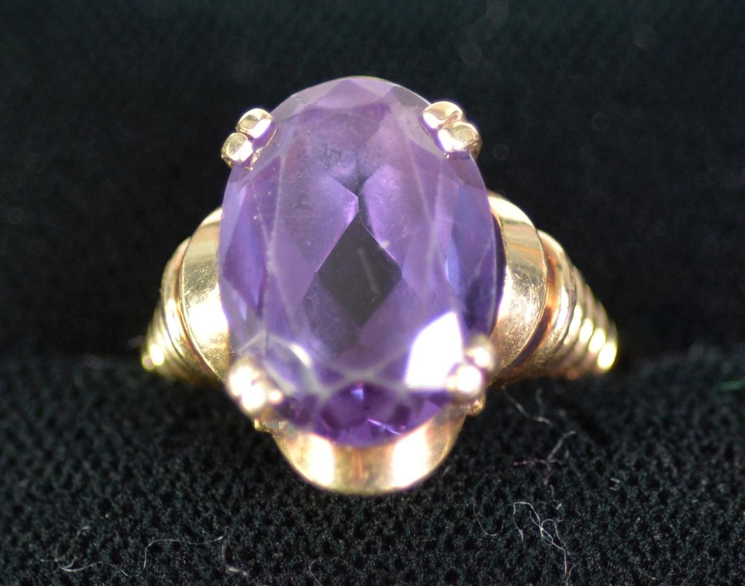 14CT GOLD DRESS RING, with a dark blye oval quartz, in a four claw setting, 8 gms, ring size L/M