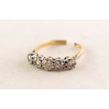18ct GOLD AND PLATINUM RING, with five old cut diamonds graduating from the centre in claw and