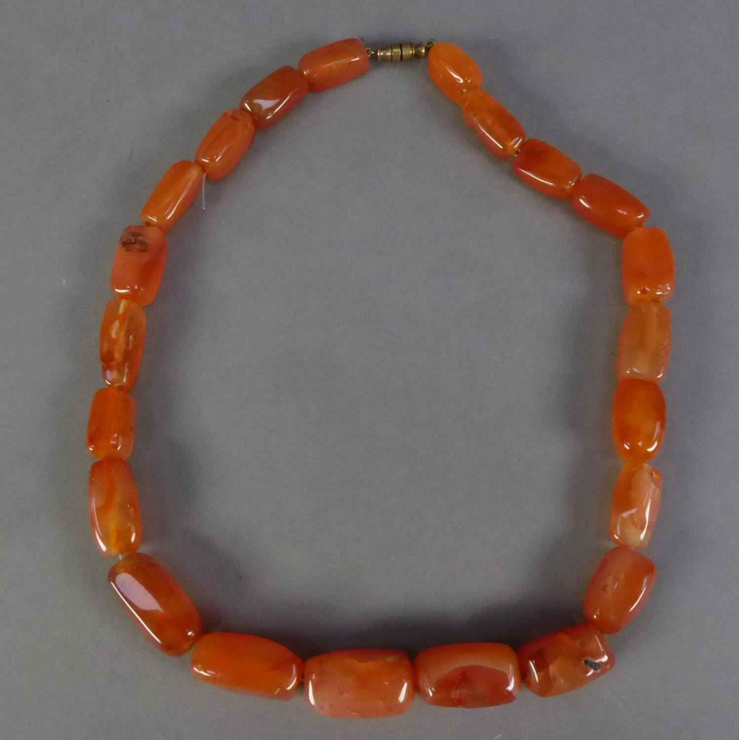 IMITATION AMBER NECKLACE of graduated rectangular beads, 17in (43.1cm) long