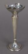GEORGE V WEIGHTED SILVER TRUMPET VASE, with quatrefoil cupped top, tapering, panelled stem and