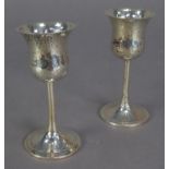 GEORGE V PAIR OF PLANISHED SILVER SMALL GOBLETS BY WALKER & HALL, each with thistle shaped bowl,