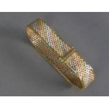 9ct THREE COLOUR GOLD BROAD MESH BRACELET wiht bright cut engraved raised borders, 1/2in (1.25cm)