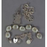 CHINESE SILVER BRACELET with seven oval liks set with mother of pearl overlaid with Chinese