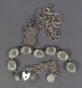 CHINESE SILVER BRACELET with seven oval liks set with mother of pearl overlaid with Chinese