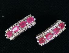 PAIR OF WHITE GOLD (unmarked) RUBY AND DIAMOND EARRINGS for pierced ears, each earring slightly