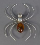 A .925 STAMPED SILVER SPIDER BROOCH with amber set abdomen