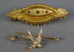 EARLY 20th CENTURY 9ct GOLD ELLIPTICAL BROOCH set with three tiny rubies and two seed pearls, also