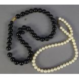 SINGLE STRAND NECKLACE OF SLIGHTLY GRADUATED CULTURED PEARLS, with silver clasp, 14in (35.5cm)