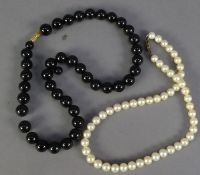 SINGLE STRAND NECKLACE OF SLIGHTLY GRADUATED CULTURED PEARLS, with silver clasp, 14in (35.5cm)