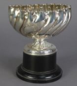 LATE VICTORIAN EMBOSSED SILVER ROSE BOWL, of wrythen fluted form with vacant C scroll cartouche,