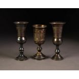 TWO ENGRAVED SILVER SMALL WINE GOBLETS, together with a SIMILAR, FOREIGN SILVER EXAMPLE, 4? (10.2cm)