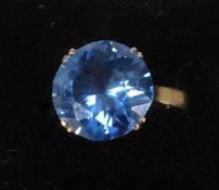 18ct GOLD RING claw set with a large circular vivid blue Ratanakiri zircon, brilliant cut, 13mm in