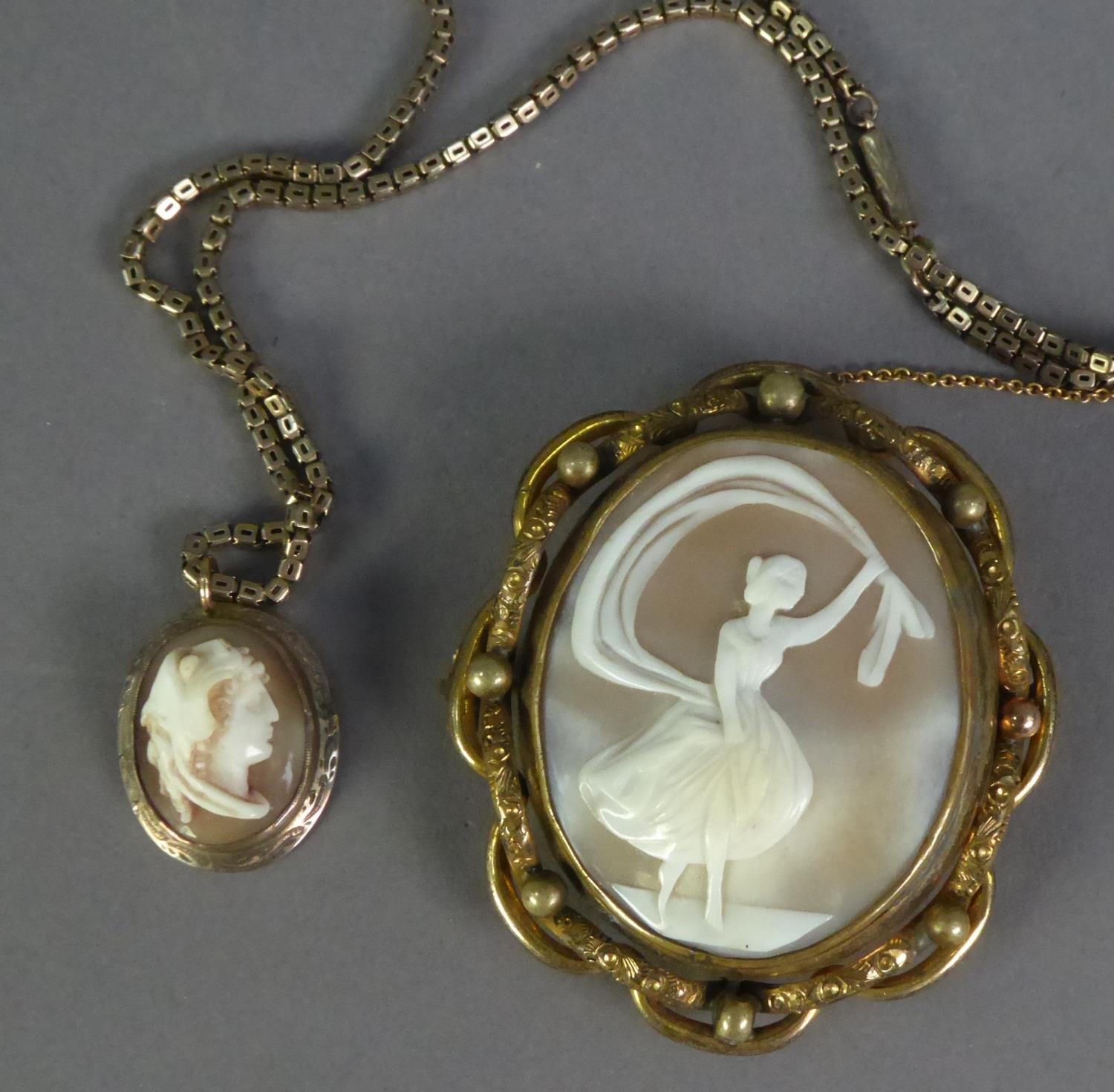 LATE VICTORIAN CARVED SHELL CAMEO BROOCH in pinchbeck mount, with locket reverse and safety chain,