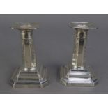PAIR OF EDWARDIAN SILVER SHORT, WEIGHTED CANDLESTICKS, the tapered octagonal column alternately