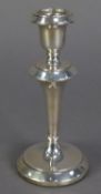 GEORGE V WEIGHTED SILVER CANDLESTICK, with campana shaped sconce, tapering stem and circular foot, 6