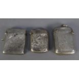 THREE EDWARD VII ENGRAVED SILVER VESTA CASES, including one embossed with the ISLE OF MAN LEGS,