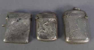 THREE EDWARD VII ENGRAVED SILVER VESTA CASES, including one embossed with the ISLE OF MAN LEGS,
