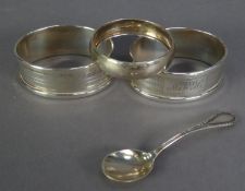 PAIR OF SILVER NAPKIN RINGS, of oval, engine turned form, initialled, together with ANOTHER,