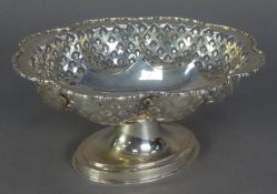 GEORGE V PIERCED SILVER PEDESTAL CAKE DISH, of oval lobated form with lattice pierced sides,