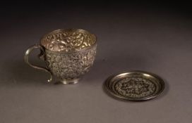 UNMARKED INDIAN EMBOSSED SILVER COLOURED METAL TEACUP, of typical form, profusely decorated with