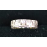 18K WHITE GOLD BAND RING wiht embossed and panelled decoration, 3 gms, ring size L/M