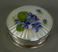 GEORGE V GUILLOCHE ENAMELLED SILVER PILL BOX, of circular form with gilt interior and floral painted