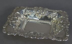 LATE VICTORIAN EMBOSSED SILVER BON BON DISH, of oblong form, embossed with fruit within a scroll