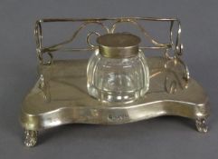 GEORGE V SILVER INK STAND of serpentine outline, having wire pattern 3/4 gallery back