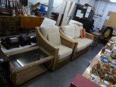 A BAMBOO AND CANE CONSERVATORY SETTEE AND MATCHING ARMCHAIR, WITH CUSHIONS AND AN OBLONG COFFEE